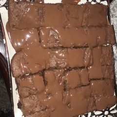 A picture of Fudgy brownies with melted chocolate.