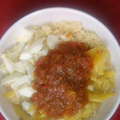 A picture of Couscous & fried potato with egg.