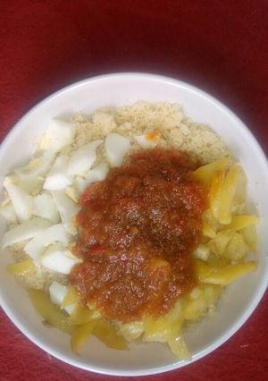 A picture of Couscous & fried potato with egg.