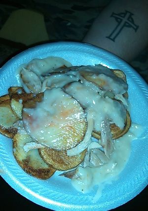 A picture of Irish Potato Stacks w/ gravy.