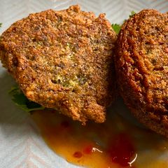 A picture of Queen of Pulse Fritters with Sweet Chilli Sauce.