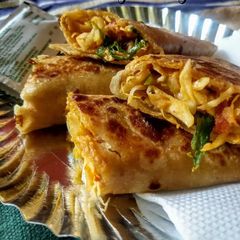 A picture of Veg Schezwan Frankie.