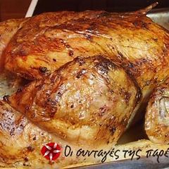 A picture of Chicken with potatoes in the oven.