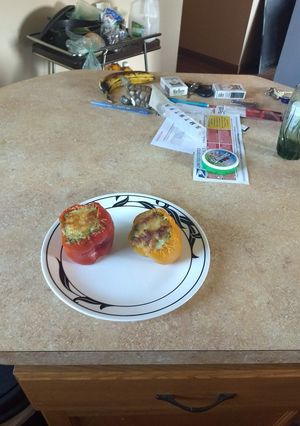 A picture of Spinach Artichoke stuffed Peppers.