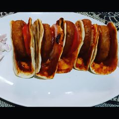 A picture of Naan aloo tikki burger.
