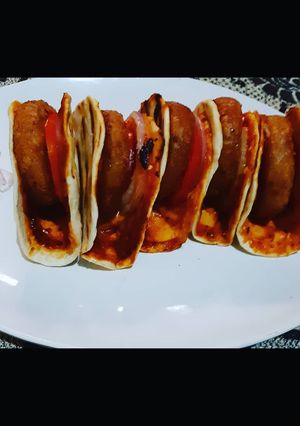 A picture of Naan aloo tikki burger.