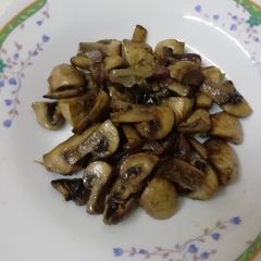 A picture of Sautéed mushrooms and onions.