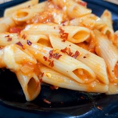 A picture of Cheesy Penne in tomato salsa.