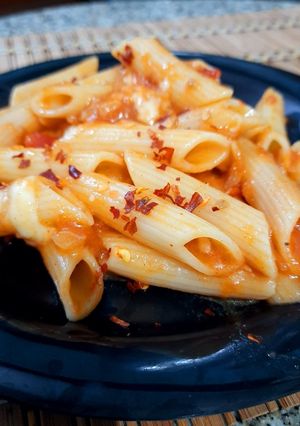 A picture of Cheesy Penne in tomato salsa.