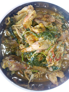 A picture of Chicken pepper soup with spinach.