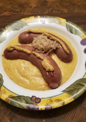 A picture of Brad's bratwurst w/ German inspired yellow polenta.