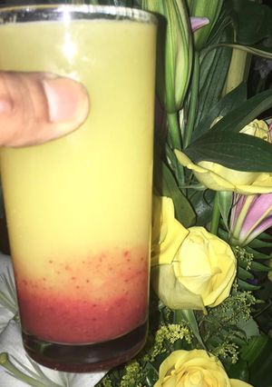 Una foto de Coulis de fresa con naranja