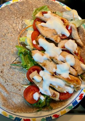 A picture of Homemade Piadina with Chicken, Salad, and Yogurt 🌮🍗🍅🥬.