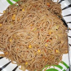 Jollof spaghetti with veggies A picture of Jollof spaghetti with veggies.