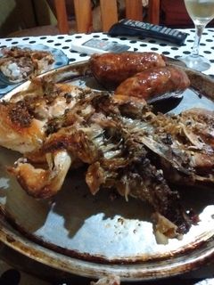 Una foto de Asado a la parrilla de pollo inyectado con limón y jugó de chimichurri