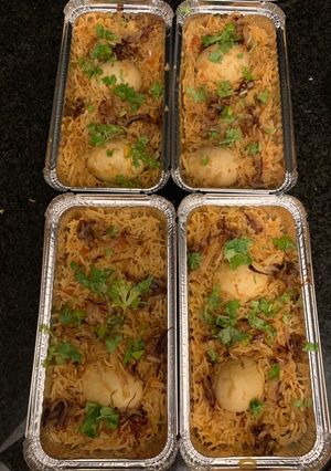 A picture of Egg Briyani with Raita.