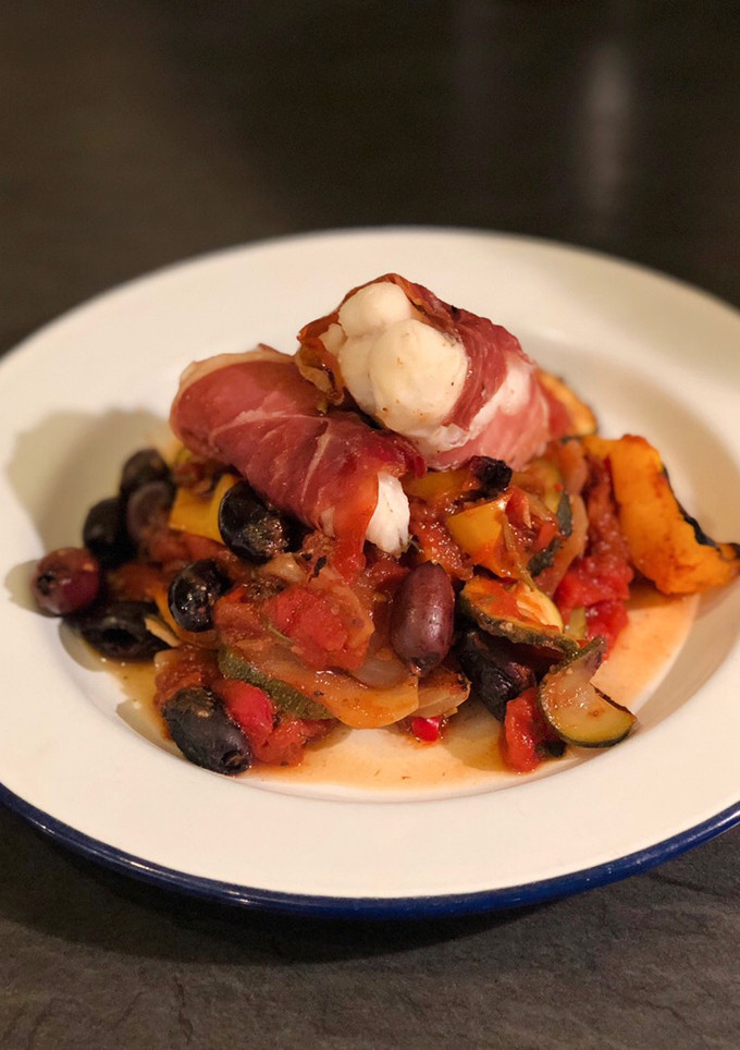 A picture of Monkfish in Parma ham with kalamata olive ratatouille.