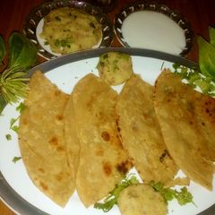 A picture of Aloo prhta with bhurta sweet yogert.