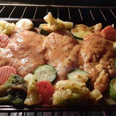 A picture of Baked Italian chicken breast with roasted veggies.