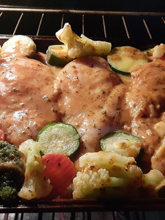 A picture of Baked Italian chicken breast with roasted veggies.