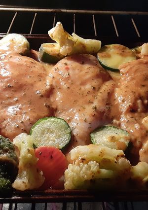 A picture of Baked Italian chicken breast with roasted veggies.
