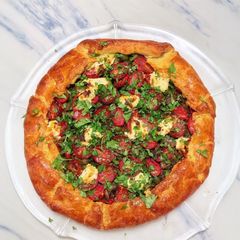 A picture of Puttanesca galette with lemon ricotta.