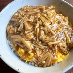 A picture of Omelette Rice Bowl with Enoki Sauce.