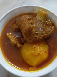 A picture of Mutton Curry with Potato.
