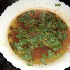 A picture of Tomato Rasam (Soup).
