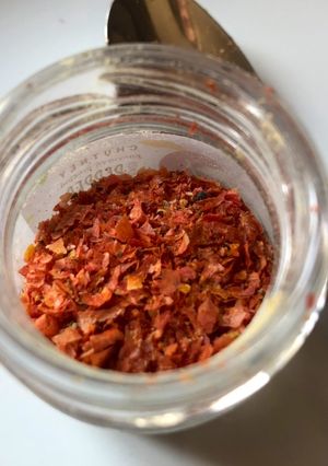A picture of Tomato peels in a jar.