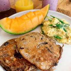 Banana pancakes with pecan nuts and fresh blueberries A picture of Banana pancakes with pecan nuts and fresh blueberries.