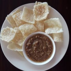A picture of Crispy Rice with tamarind sauce.