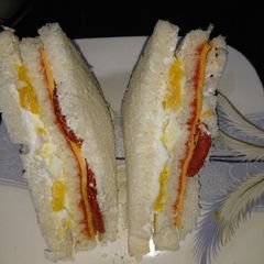 A picture of Sandwich of pepperoni and egg.