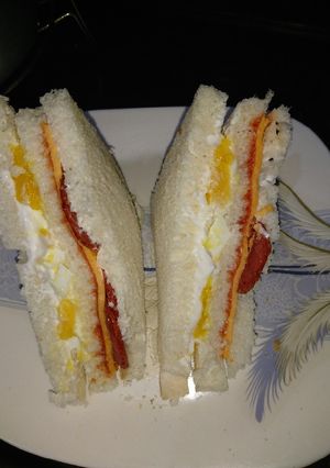 A picture of Sandwich of pepperoni and egg.