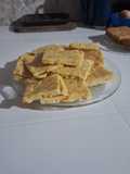 Fainá de choclos y queso rallado