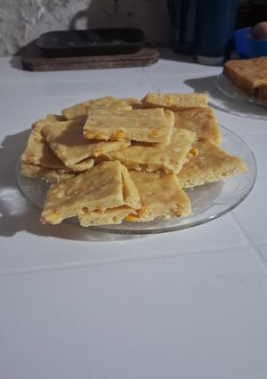 Una foto de Fainá de choclos y queso rallado