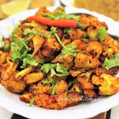 A picture of Spicy Aloo Gobhi Matar Stir Fry (Potato Cauliflower Green Peas Curry).
