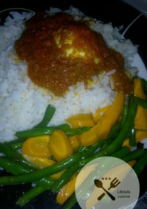 A picture of White rice boiled egg stew with buttered vegs.