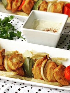 A picture of Skewered chicken kababs.