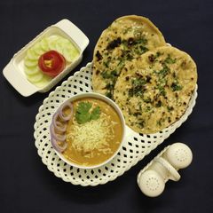 Cheese butter masala and garlic naan A picture of Cheese butter masala and garlic naan.
