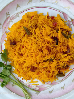 A picture of Basanti Pulao - Savor the Sunshine with the Golden grains.