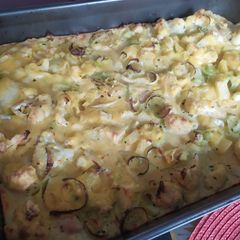 A picture of Yellow chicken veggie pie.