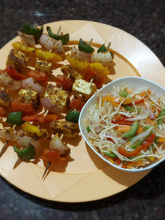 A picture of Paneer Tikka dry with salad.