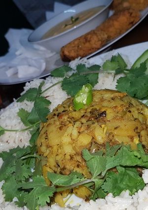A picture of Jhatpata allu with zeera rice.