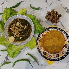 A picture of Sarson ka saag with Makai ki roti.
