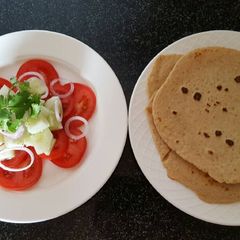 A picture of Simple salad with flat bread roti.