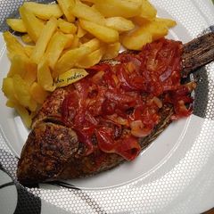 A picture of Grilled fish with chips.