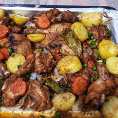 A picture of Baked chicken with vegetables.
