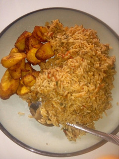 A picture of Jollof rice and fried plantain.