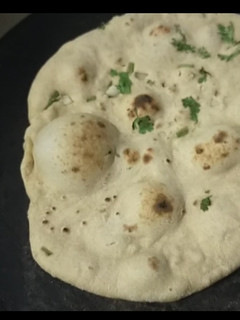A picture of Whole wheat Naan on tawa.